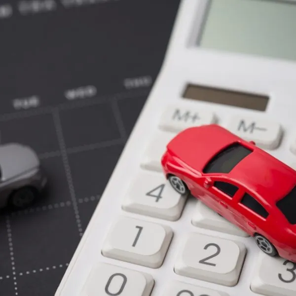 Toy,Cars,Model,,Black,Calendar,And,White,Calculator.,Money,Financial Does Paying Monthly for Car Insurance Cost More?