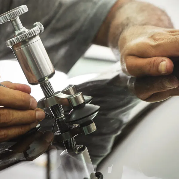 Mechanic,Using,Repairing,Equipment,To,Fix,Damaged,Windshield Does Car Insurance Cover Windshield Repairs?